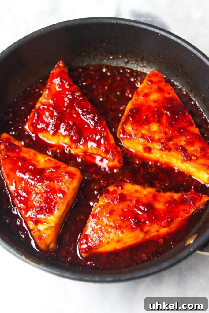 4 wedges of halloumi tossed through red honey harissa sauce.