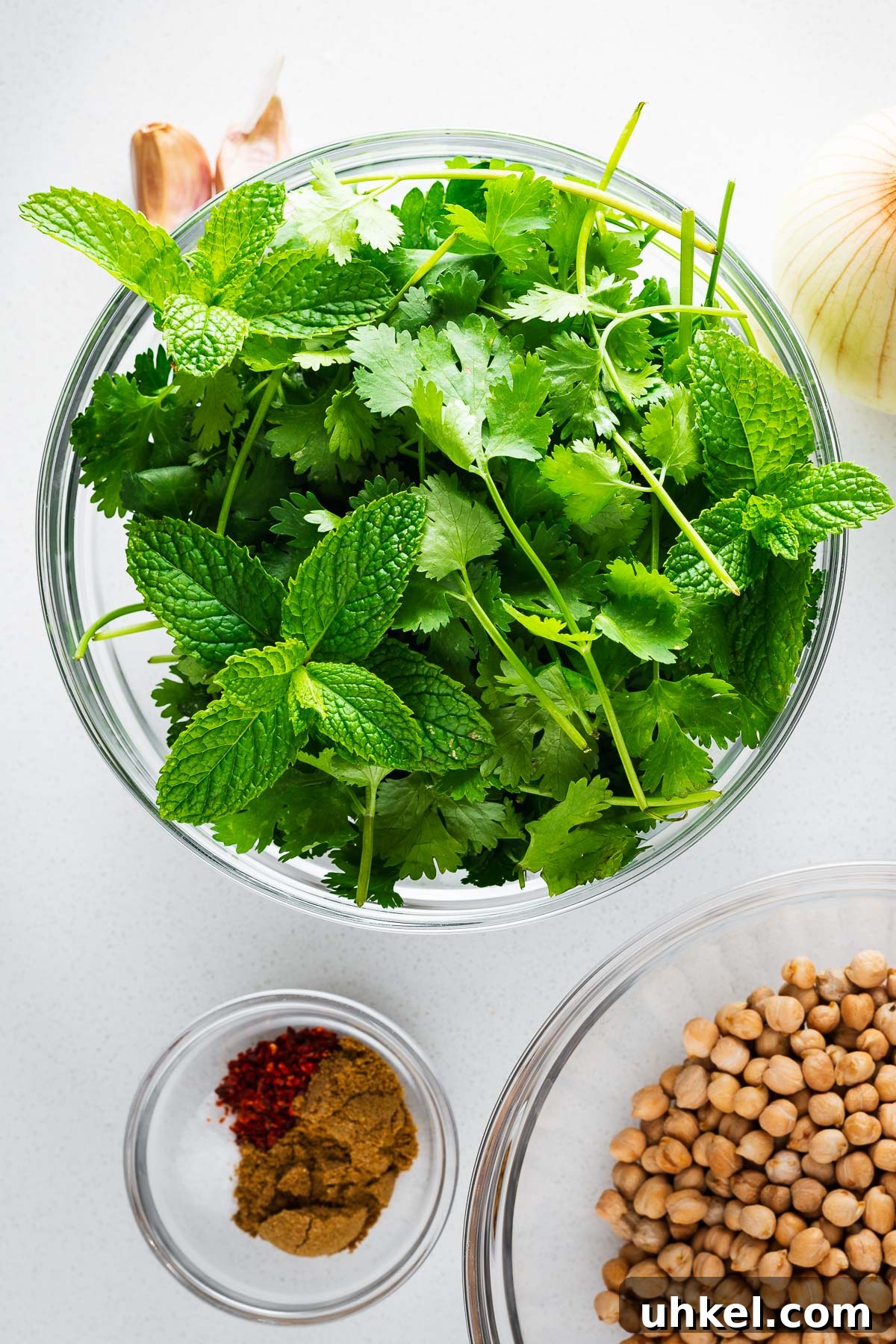 Crispy Authentic Middle Eastern Falafel Recipe 4 Fresh herbs for falafel mix viewed from above with more falafel ingredients.