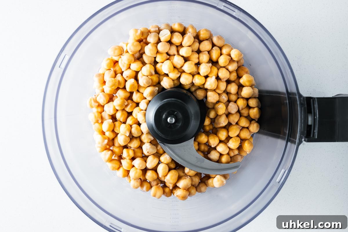 Crispy Authentic Middle Eastern Falafel Recipe 7 Dried chickpeas that were soaked overnight in cold water in the bowl of a food processor.
