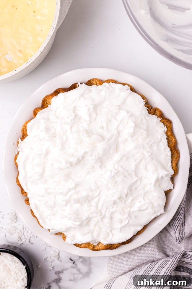 meringue spread and sealed over pie and ready to bake