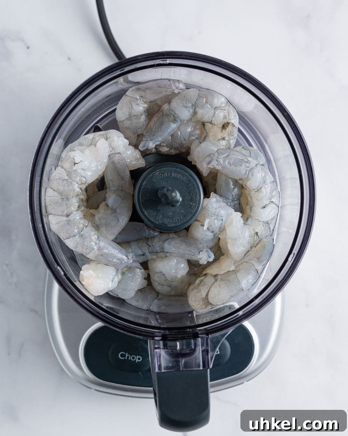 Whole shrimps in the food processor.