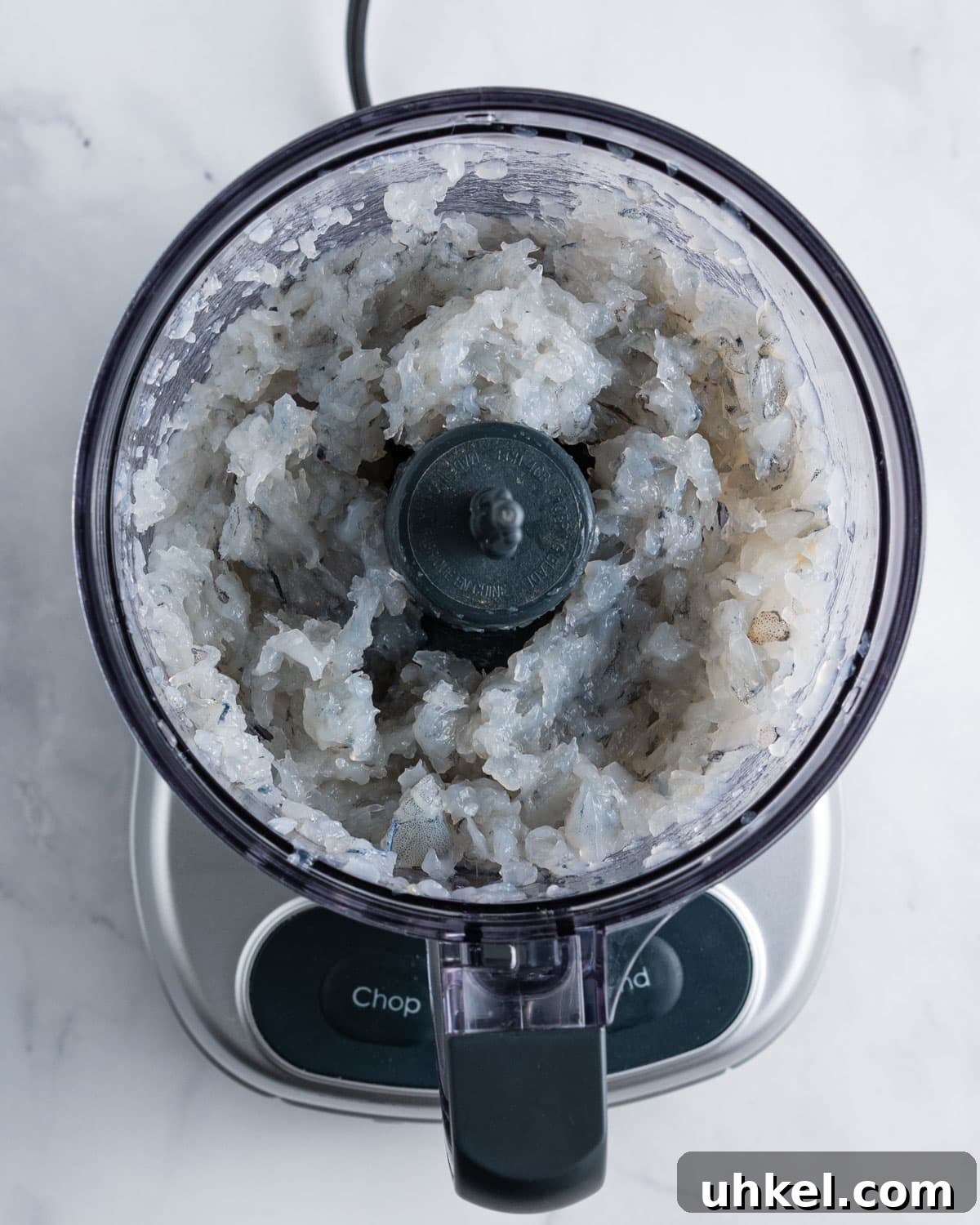 Chopped shrimp in a food processor.