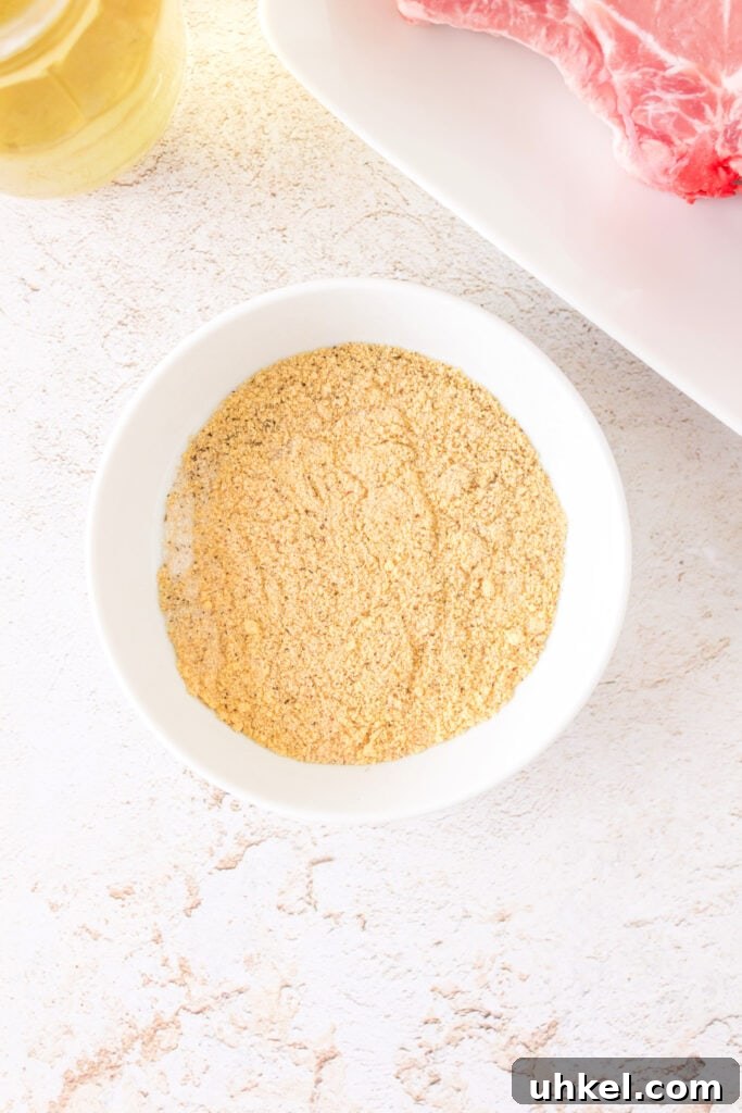 Smoked Pork Chops Recipe: Tender, Juicy Flavor from the Smoker 6 Mixed spice rub in a white bowl ready for seasoning the pork chops