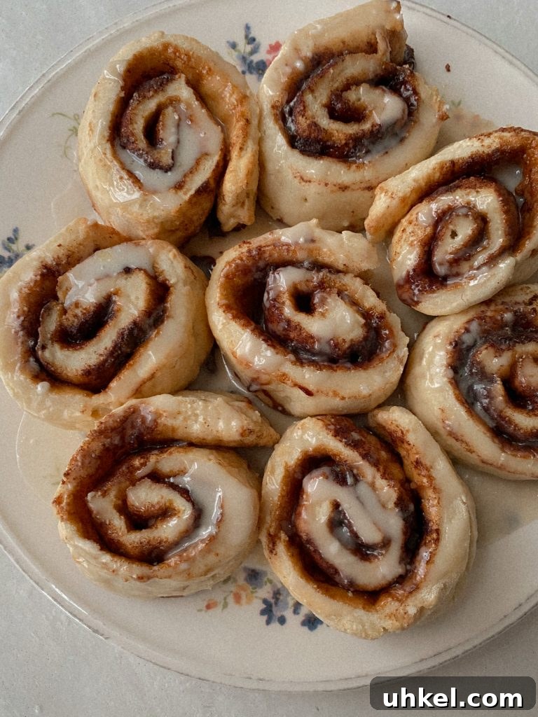 Gluten-Free Easter Brunch Menu Ideas and Recipes 2 gluten free cinnamon rolls on a floral plate