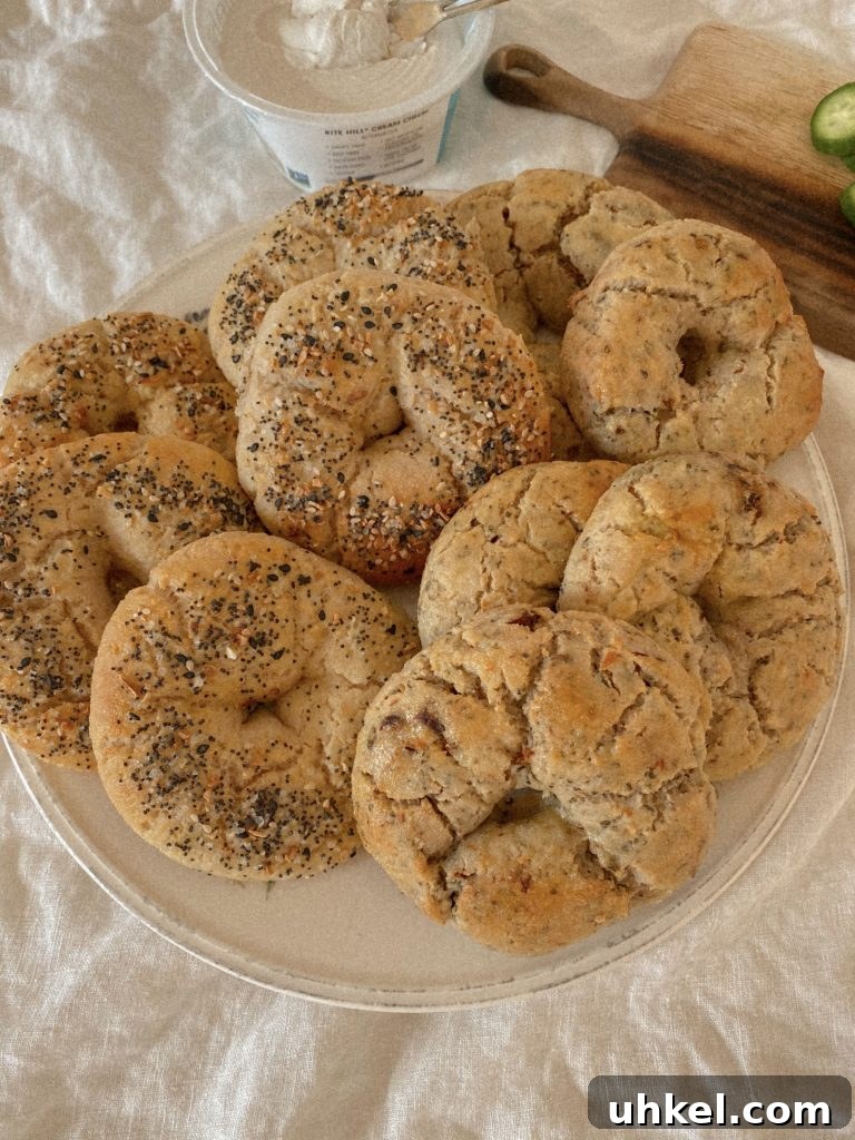 Gluten-Free Easter Brunch Menu Ideas and Recipes 5 gluten free bagels on a plate with a tub of cream cheese