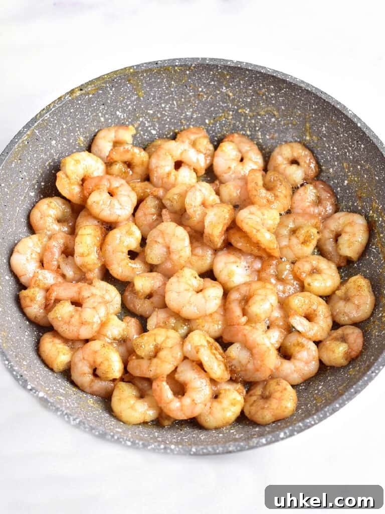 Lemon Garlic Shrimp Pasta Salad with Fresh Herbs 4 Gray bowl with cooked shrimp. White background.
