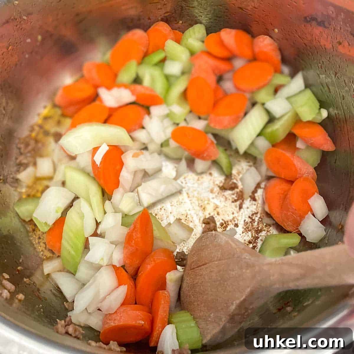 Instant Pot Tortellini Soup Recipe: Creamy Italian Comfort in 20 Minutes 6 Carrot, celery, and onion are stirred in the Instant Pot.