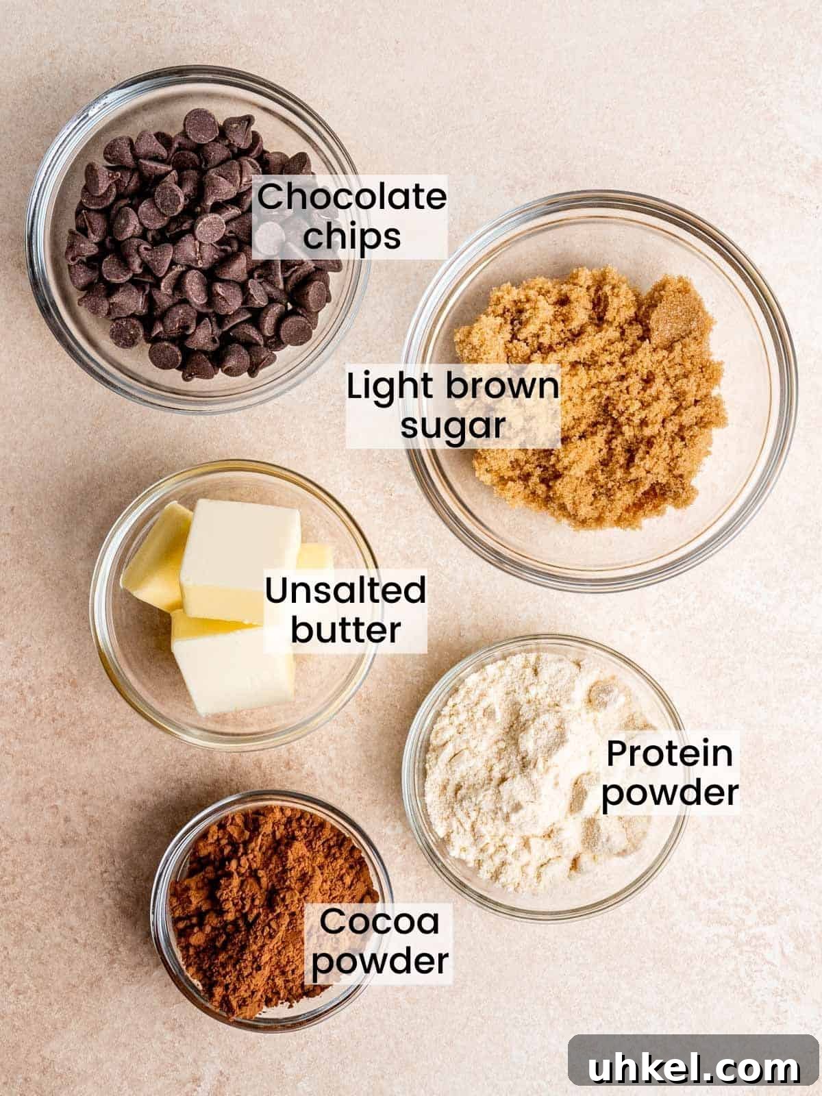 Safe-to-Eat Brownie Batter Recipe for Snacking and Desserts 3 brownie batter ingredients: chocolate chips, light brown sugar, unsalted butter, protein powder, cocoa powder