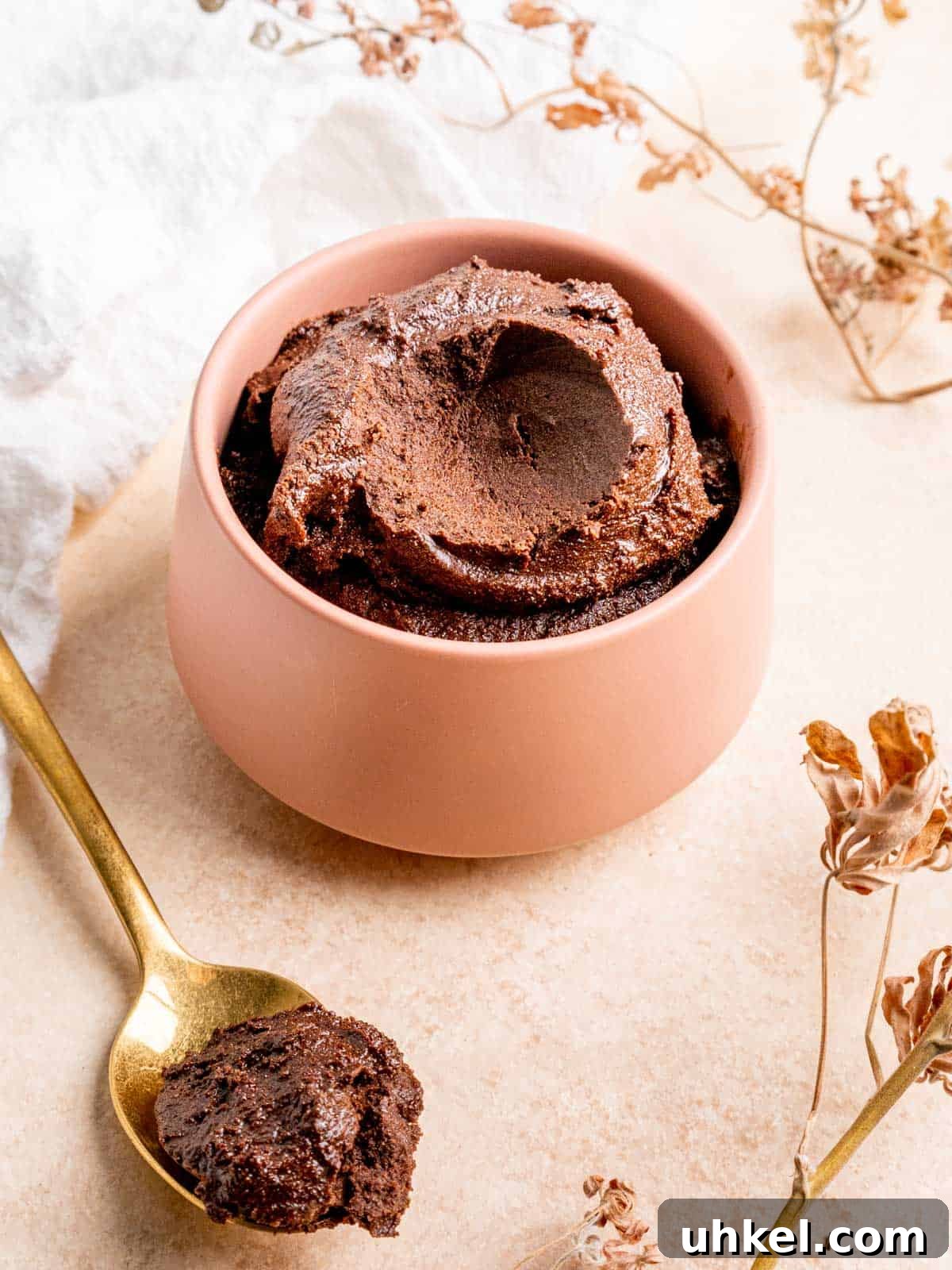 Safe-to-Eat Brownie Batter Recipe for Snacking and Desserts 9 a bowl of edible brownie batter with a spoonful taken out of it