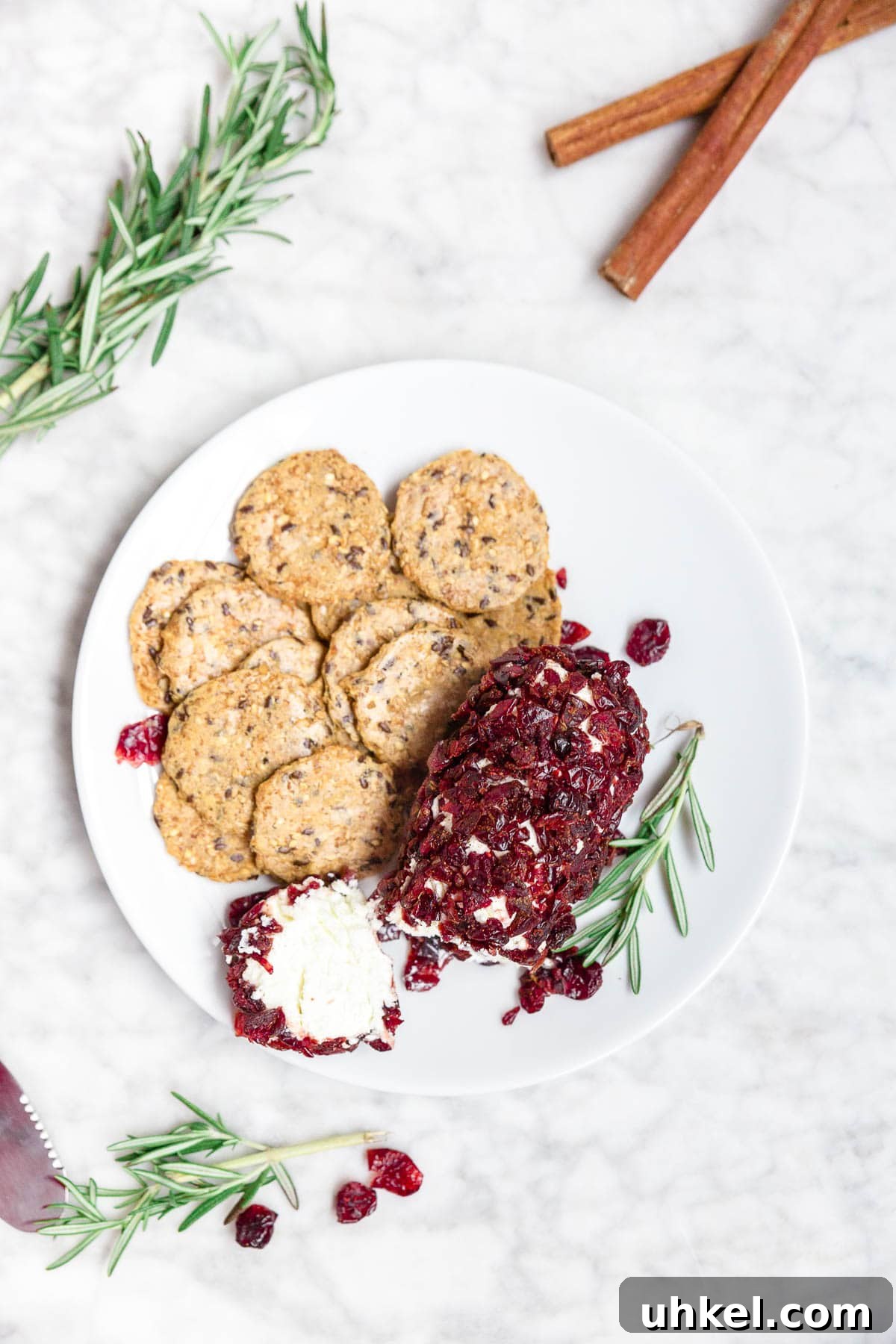 Cranberry Goat Cheese Log Recipe for Holiday Entertaining 4 A plate of gluten-free crackers and cranberry goat cheese log.