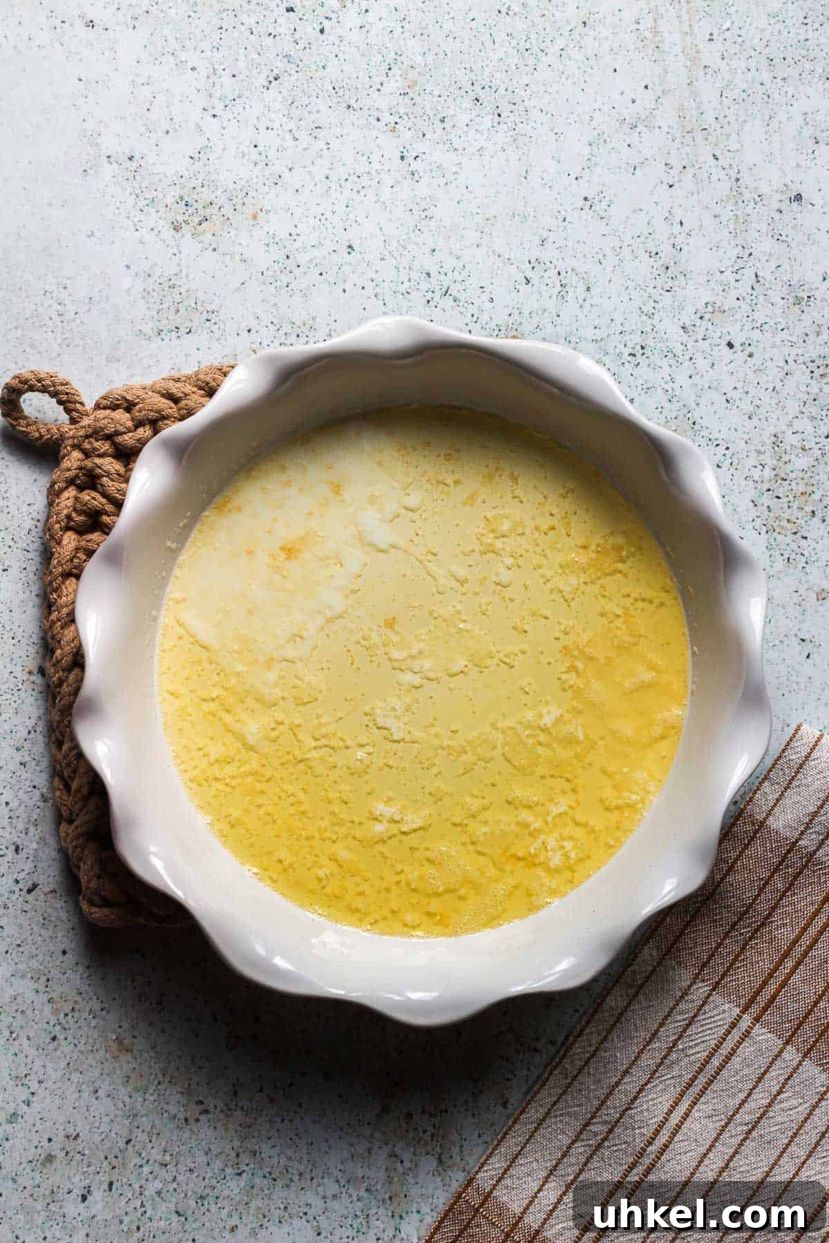 Classic Southern Peach Cobbler Recipe — Homemade & Fruity 8 melting butter in dish