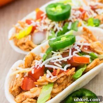 Stovetop One Pot Mexican Shredded Chicken in Flour Tortillas.