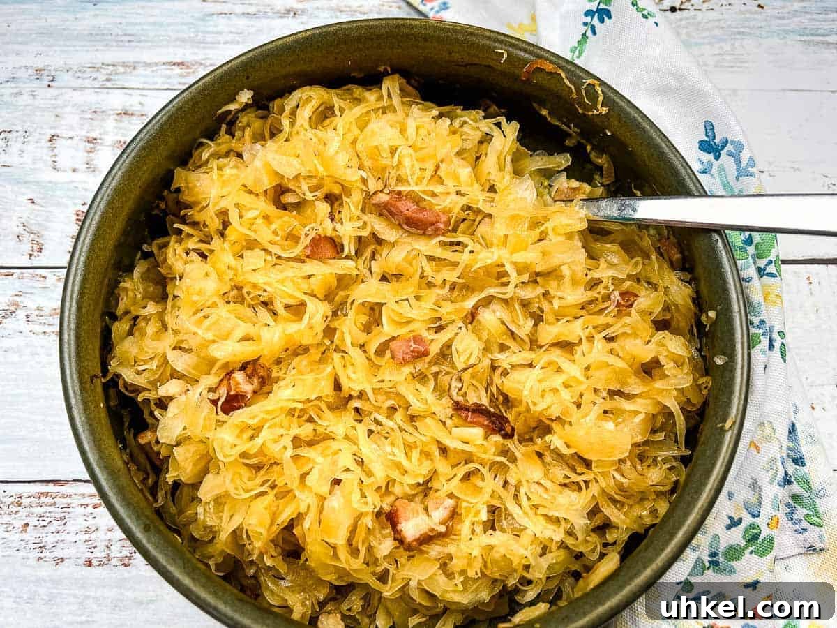 19 Budget-Friendly Dinners That Cut Your Grocery Bill (Delicious!) 13 Sauerkraut in a serving dish with a spoon.
