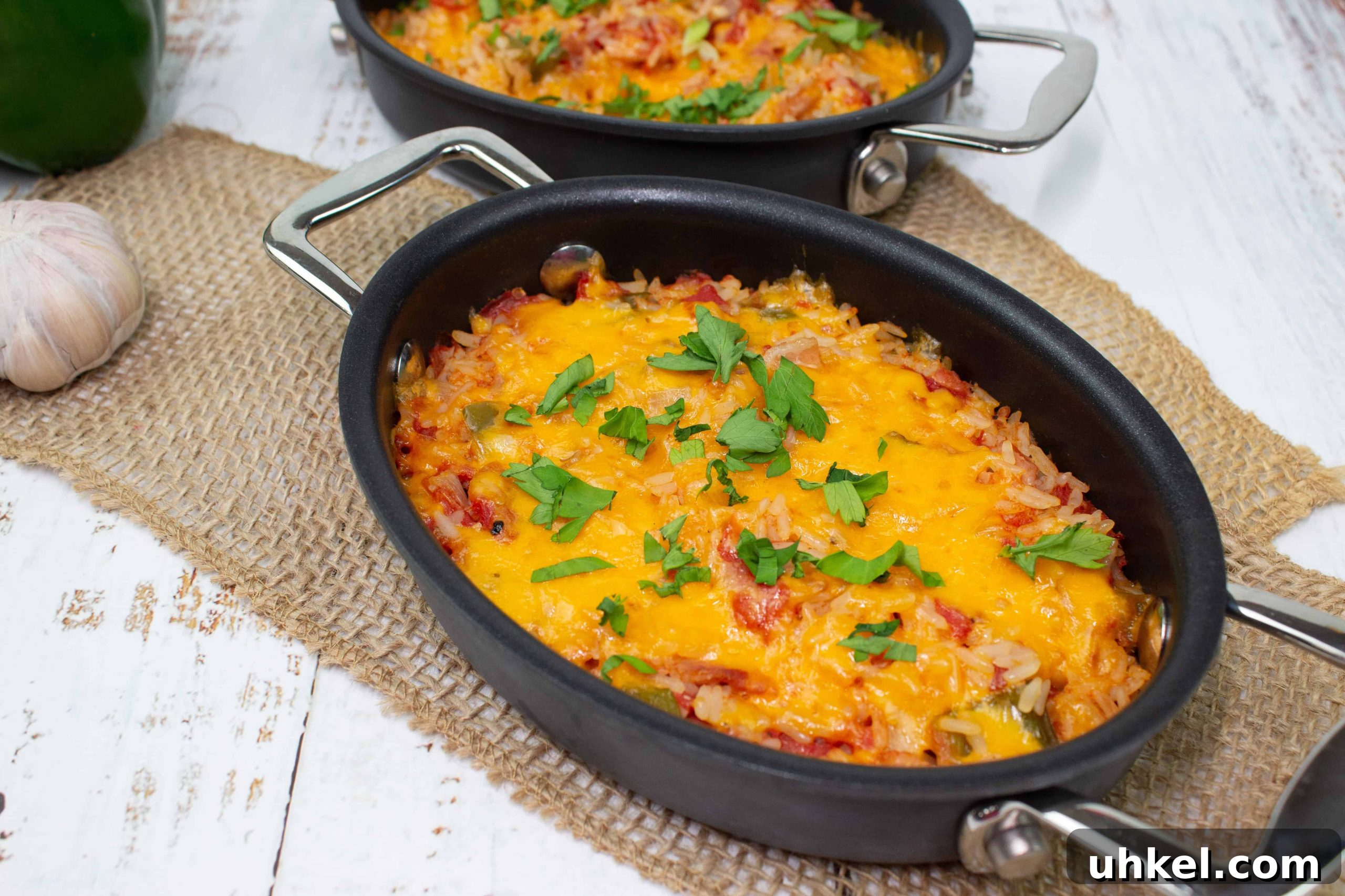 19 Budget-Friendly Dinners That Cut Your Grocery Bill (Delicious!) 7 Baked Spanish Rice in two black baking dishes.
