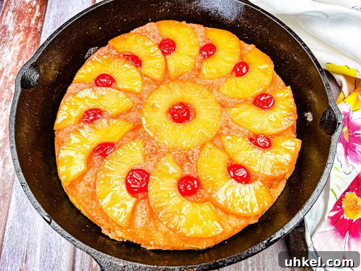 19 Budget-Friendly Dinners That Cut Your Grocery Bill (Delicious!) 10 A pineapple upside-down cake with pineapple rings and maraschino cherries in a cast iron skillet.