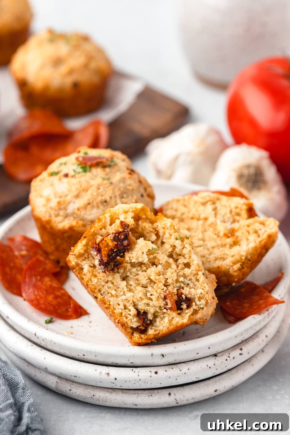 Cheesy Pizza Muffins Recipe: Savory Bite-Sized Breakfasts 8 Crispy bacon bits chocolate chip banana bread muffins in a bowl.