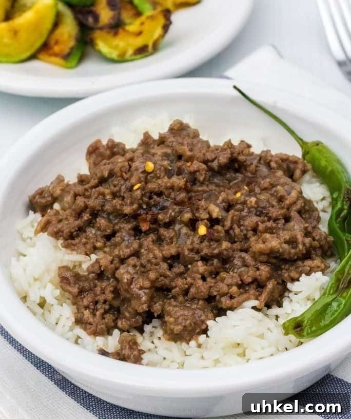 white bowl filled with Instant Pot Korean beef served over white rice
