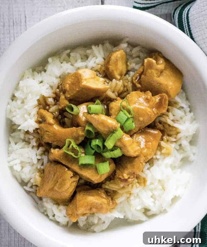 white bowl filled with Instant Pot sesame chicken and rice
