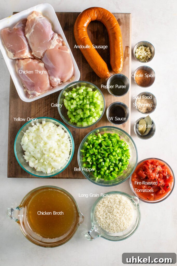 Authentic Chicken Jambalaya: Step-by-Step Homemade Recipe 4 easy chicken jambalaya ingredients. boneless skinless chicken thighs, andouille sausage, chopped garlic, creole spice, soul food seasoning, two bay leaves, pepper puree, w sauce, diced celery, diced yellow onion, diced bell pepper, chicken broth, long grain rice, and fire roasted tomatoes.