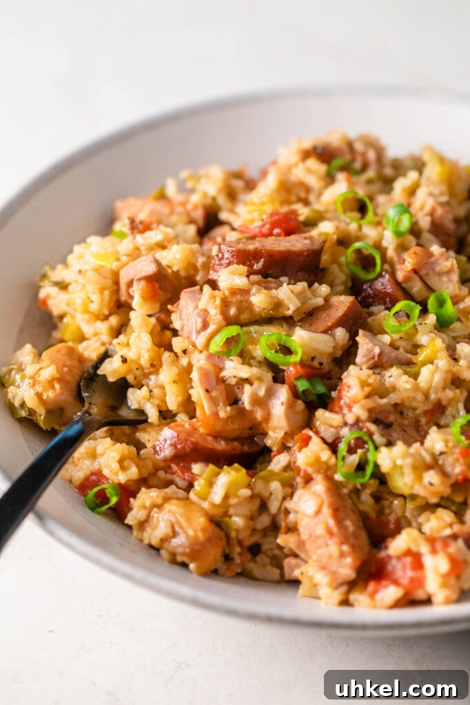 Authentic Chicken Jambalaya: Step-by-Step Homemade Recipe 6 bowl of easy chicken jambalaya with a black fork