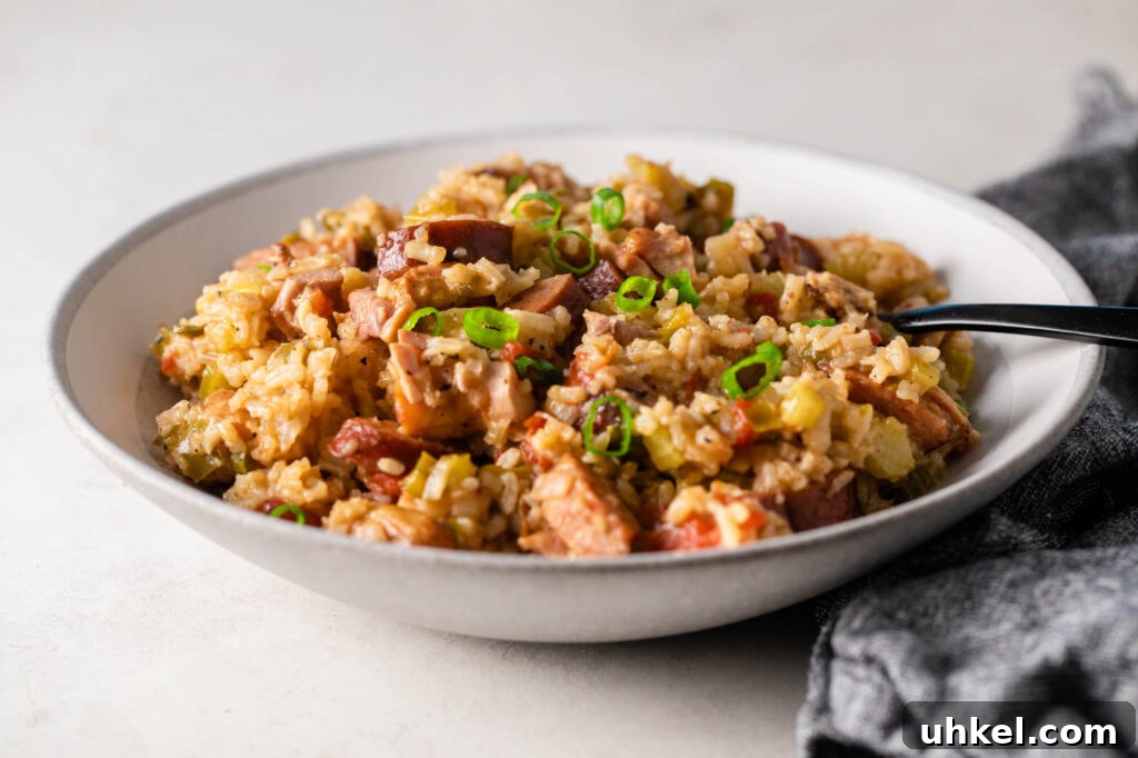 Authentic Chicken Jambalaya: Step-by-Step Homemade Recipe 8 bowl of easy chicken jambalaya with a black fork