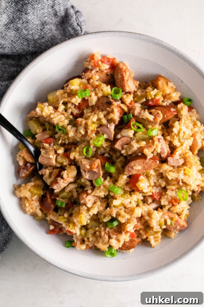 Authentic Chicken Jambalaya: Step-by-Step Homemade Recipe 9 bowl of easy chicken jambalaya with a black fork