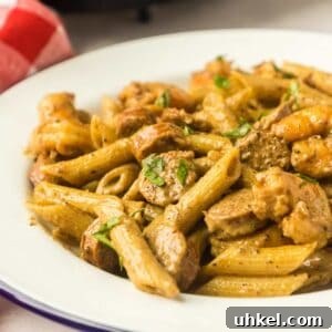 30-Minute Cast Iron Cajun Pasta Recipe 2 white plate of cajun pasta.