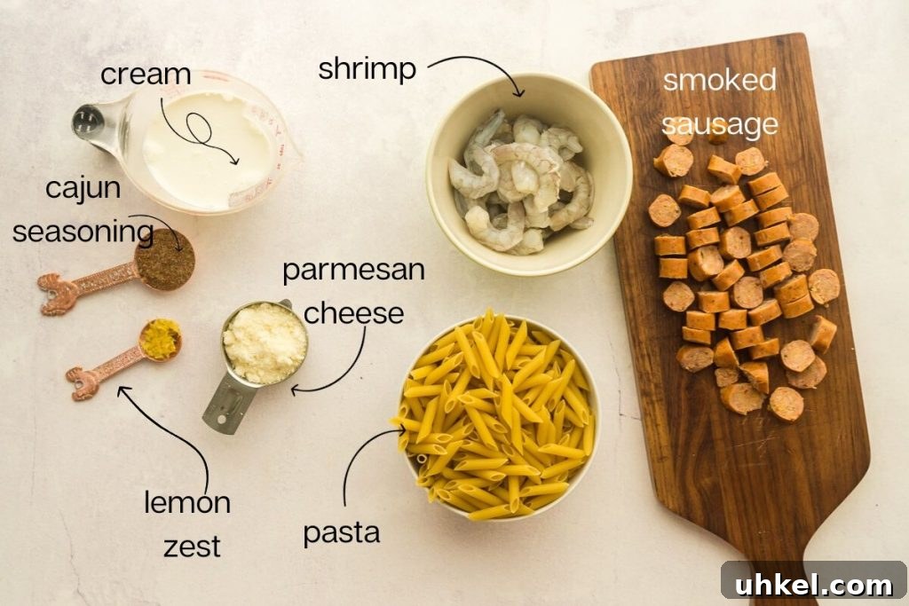 30-Minute Cast Iron Cajun Pasta Recipe 7 sausage, shrimp, pasta, and lemon zest on counter