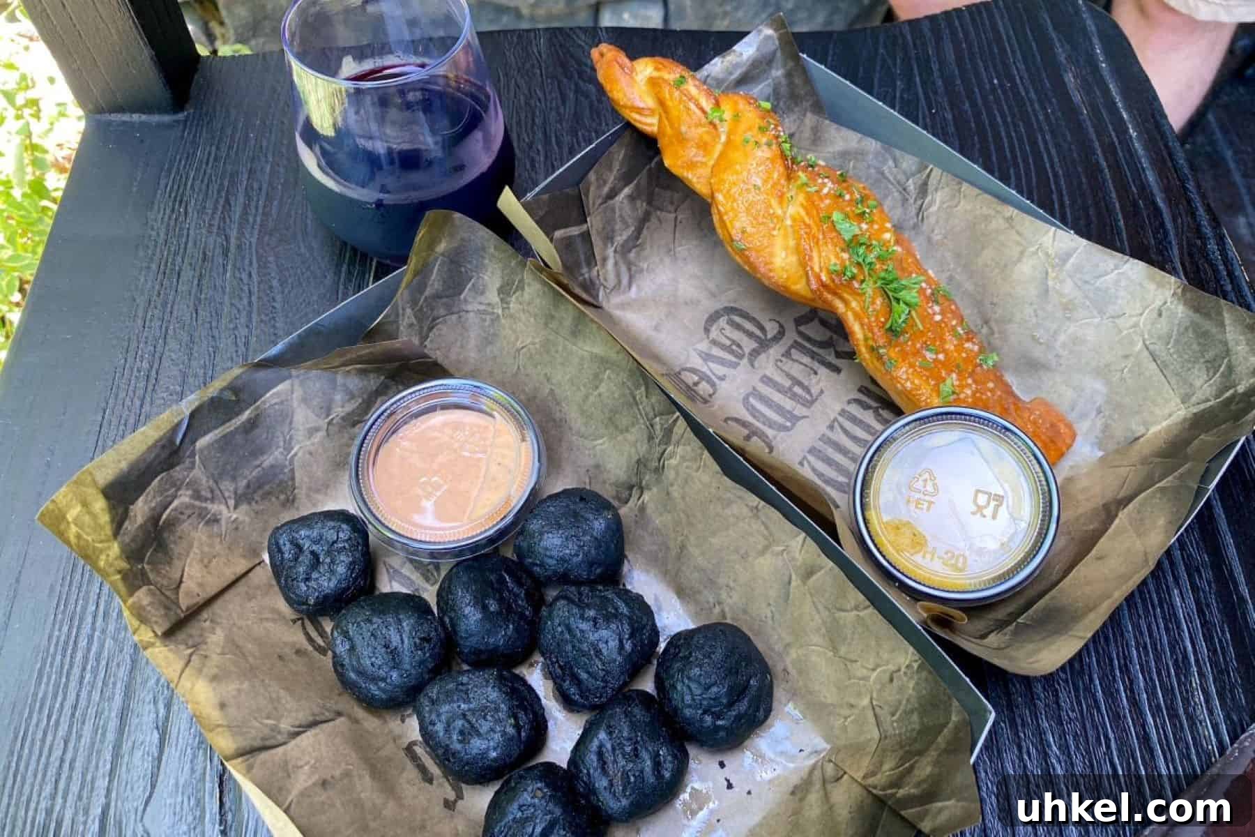 Epic Universe Food Guide: What We’ve Tried and Where to Eat 17 burning blade taver garlic stake burning cheddar bites and darkthorne mead