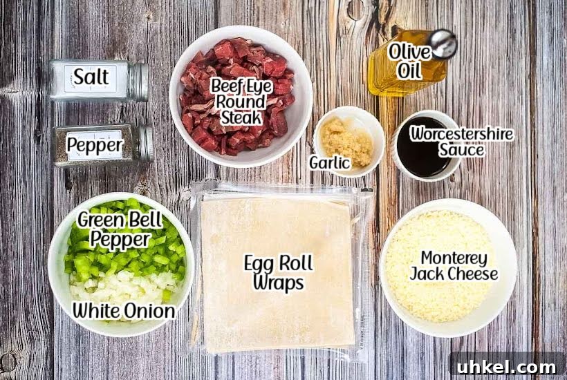 Air Fryer Cheesesteak Egg Rolls (Oven-Baked Option) 3 labeled ingredients to make air fryer cheesesteak egg rolls with text overlay.
