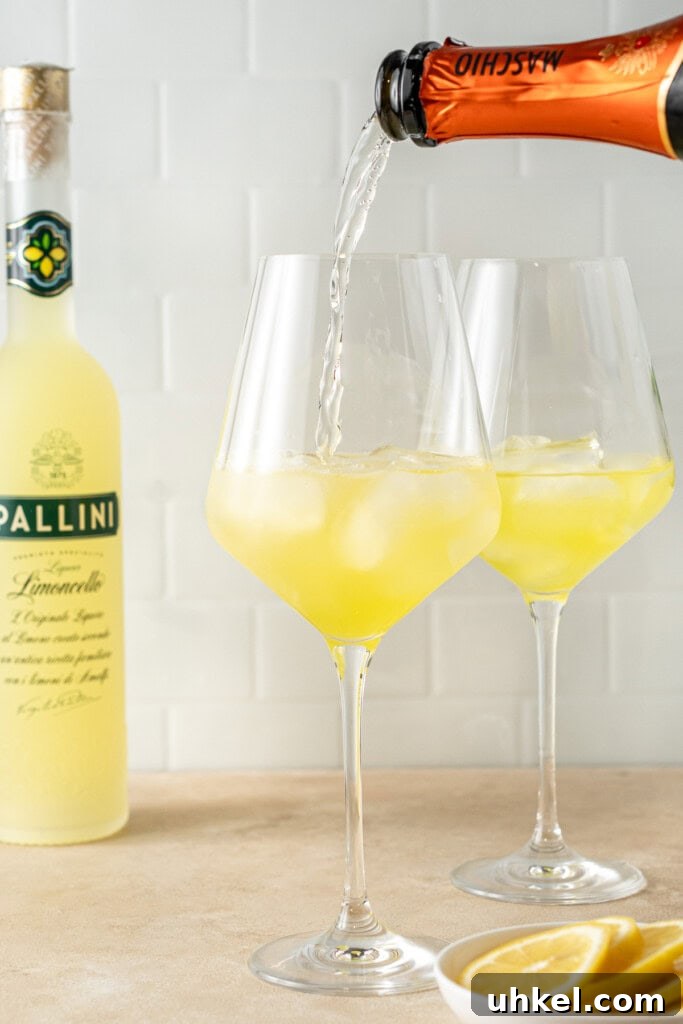 Pouring prosecco into the glass.