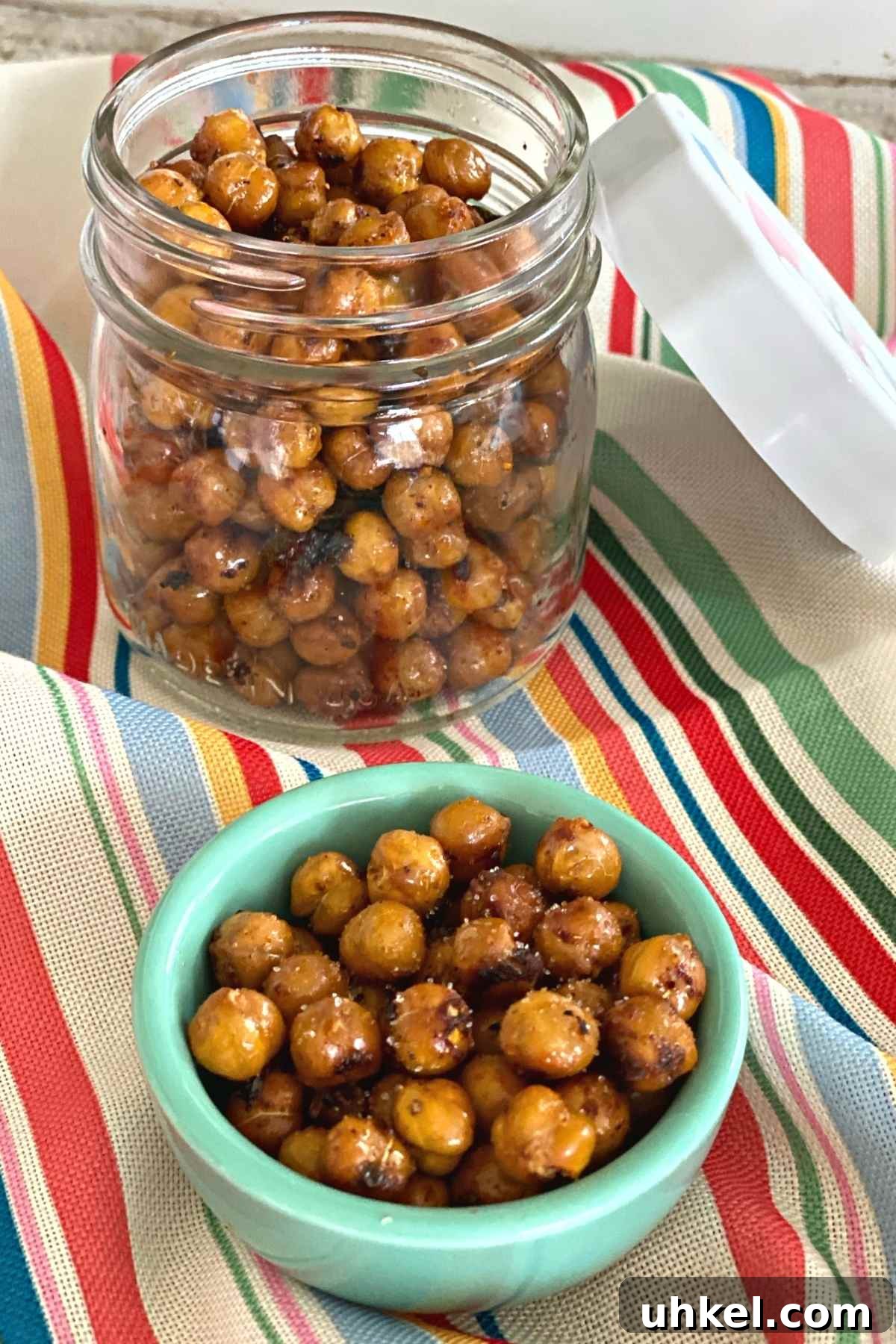 Crispy Spicy Roasted Chickpeas Recipe for Homemade Snacks 6 Mason jar and small serving bowl with spicy roasted chickpeas topped with sugar.