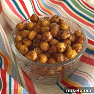 Crispy Spicy Roasted Chickpeas Recipe for Homemade Snacks 9 Sweet and spicy roasted chickpeas in a glass bowl.