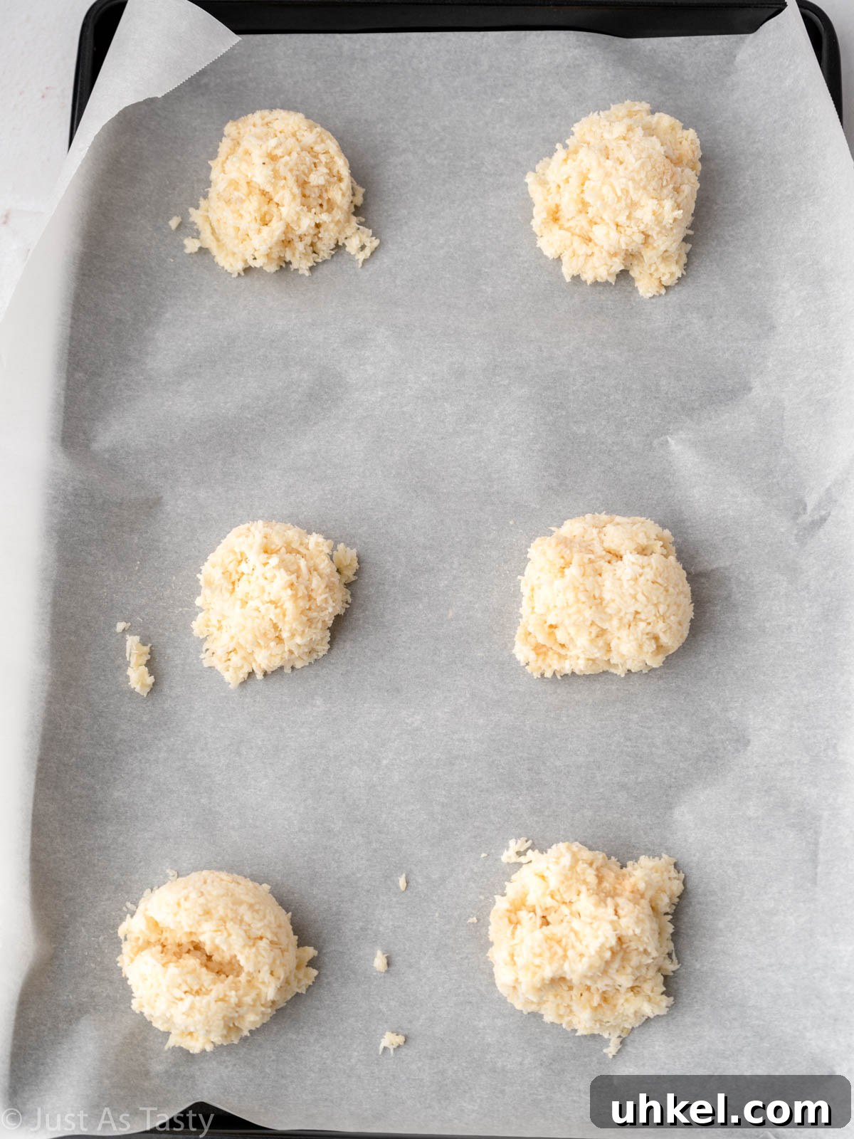 Chewy Chocolate Coconut Macaroons Made with Condensed Milk 5 Coconut macaroon mixture scooped out on lined baking sheet.