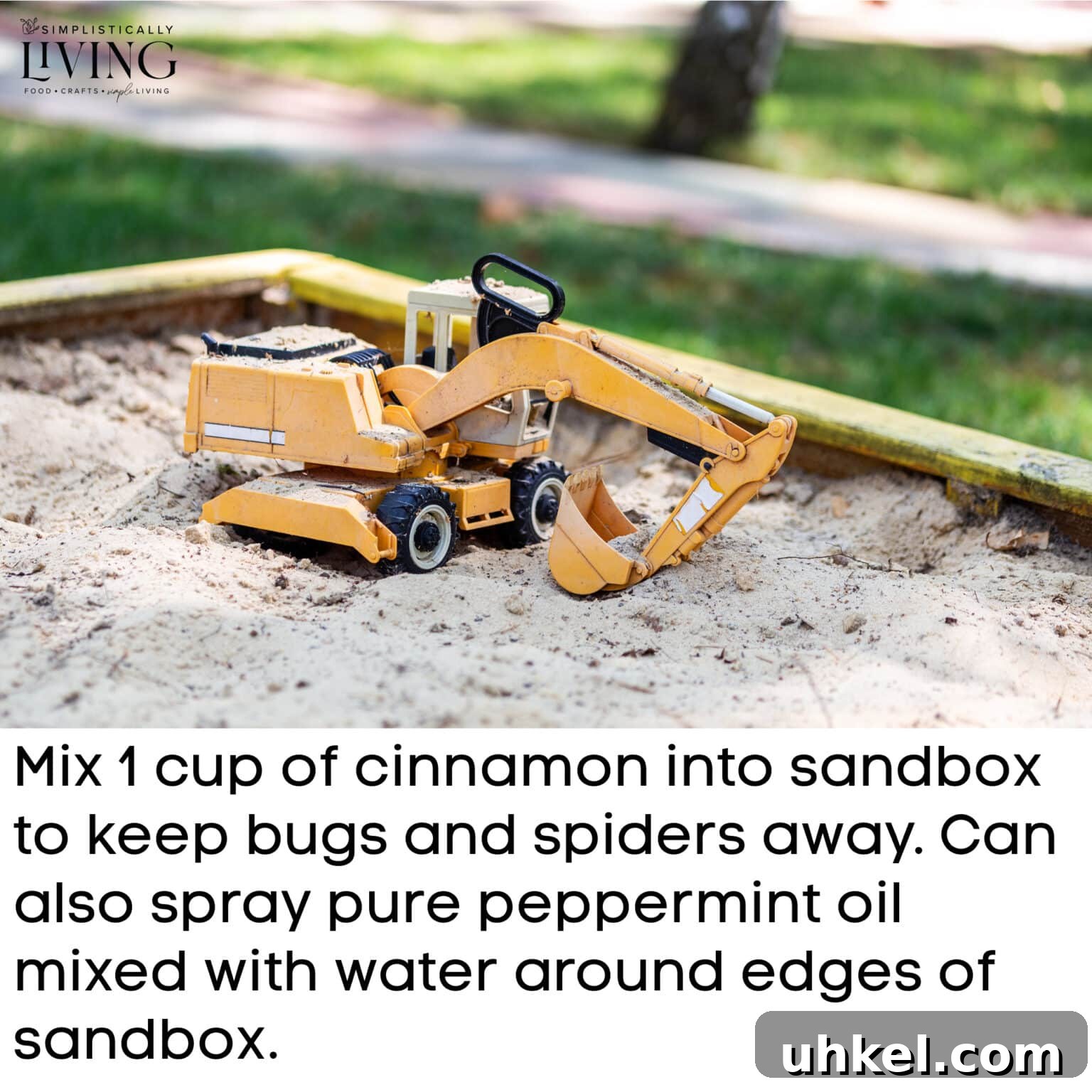 a toy dump truck inside a sandbox