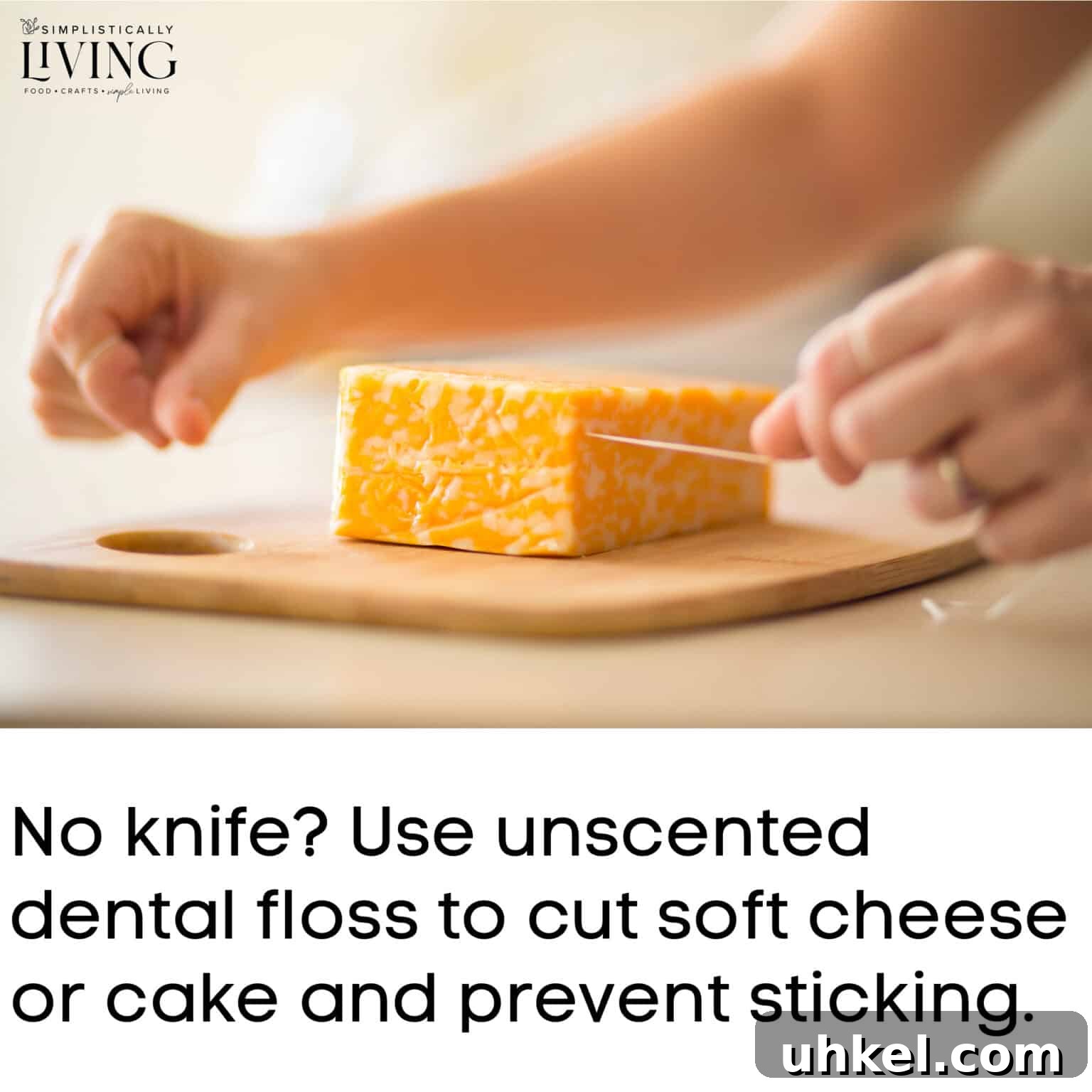 women's hands cutting cheese block using floss
