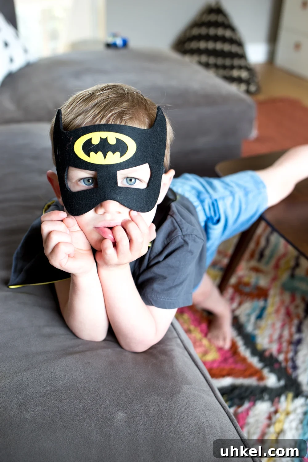 Declutter Kids' Toys: Simple Steps to Tidy Playrooms 3 toddler boy with batman mask on in play room