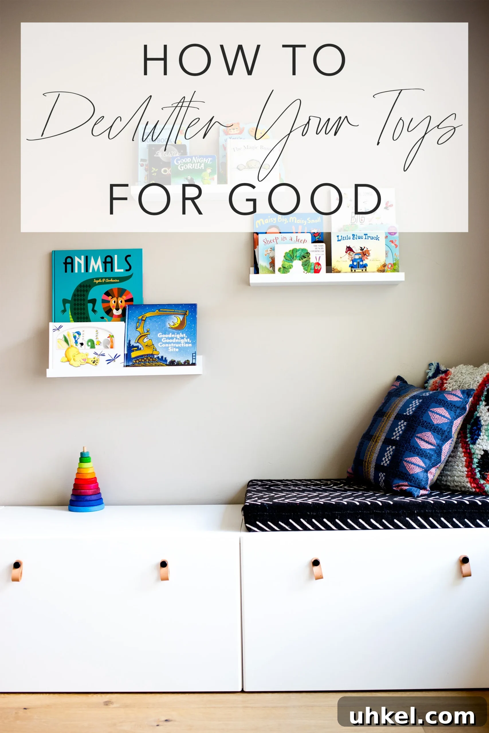 Declutter Kids' Toys: Simple Steps to Tidy Playrooms 10 Play room with white modern toy storage bench IKEA and floating white shelves with kids books and title text "how to declutter your toys for good"
