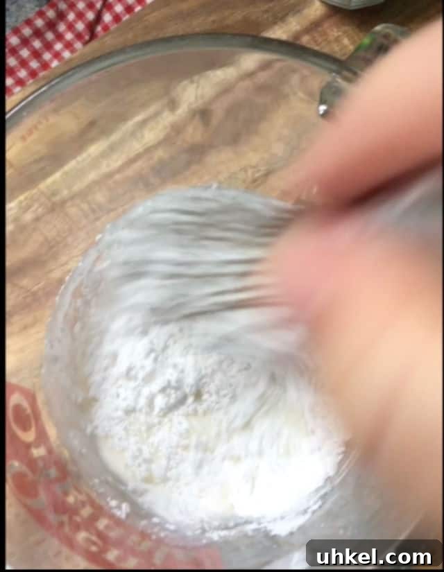How to Make Glossy Cake Glaze for Shiny, Smooth Cakes 3 mixing cake glaze ingredients together with a whisk