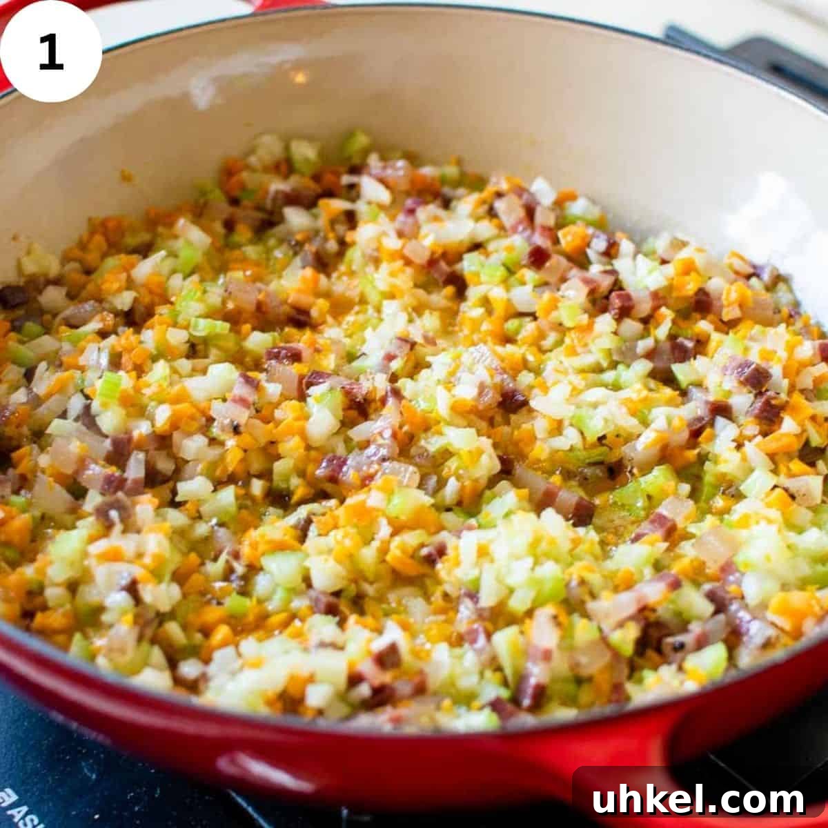 Authentic Tagliatelle alla Bolognese Recipe 4 Soffritto of vegetables in a round pan.