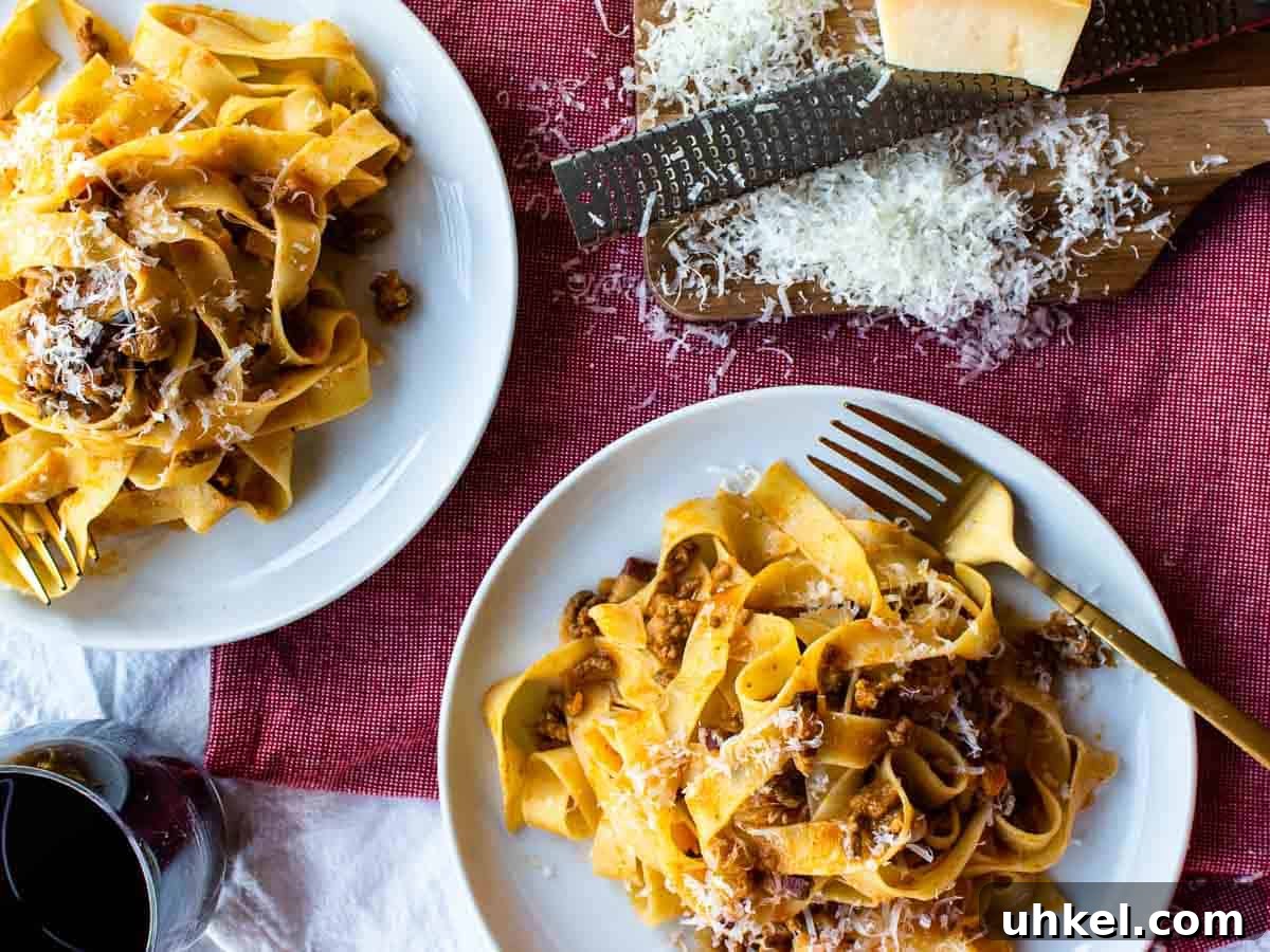 Authentic Tagliatelle alla Bolognese Recipe 10 Overhead view of two plates of pasta.