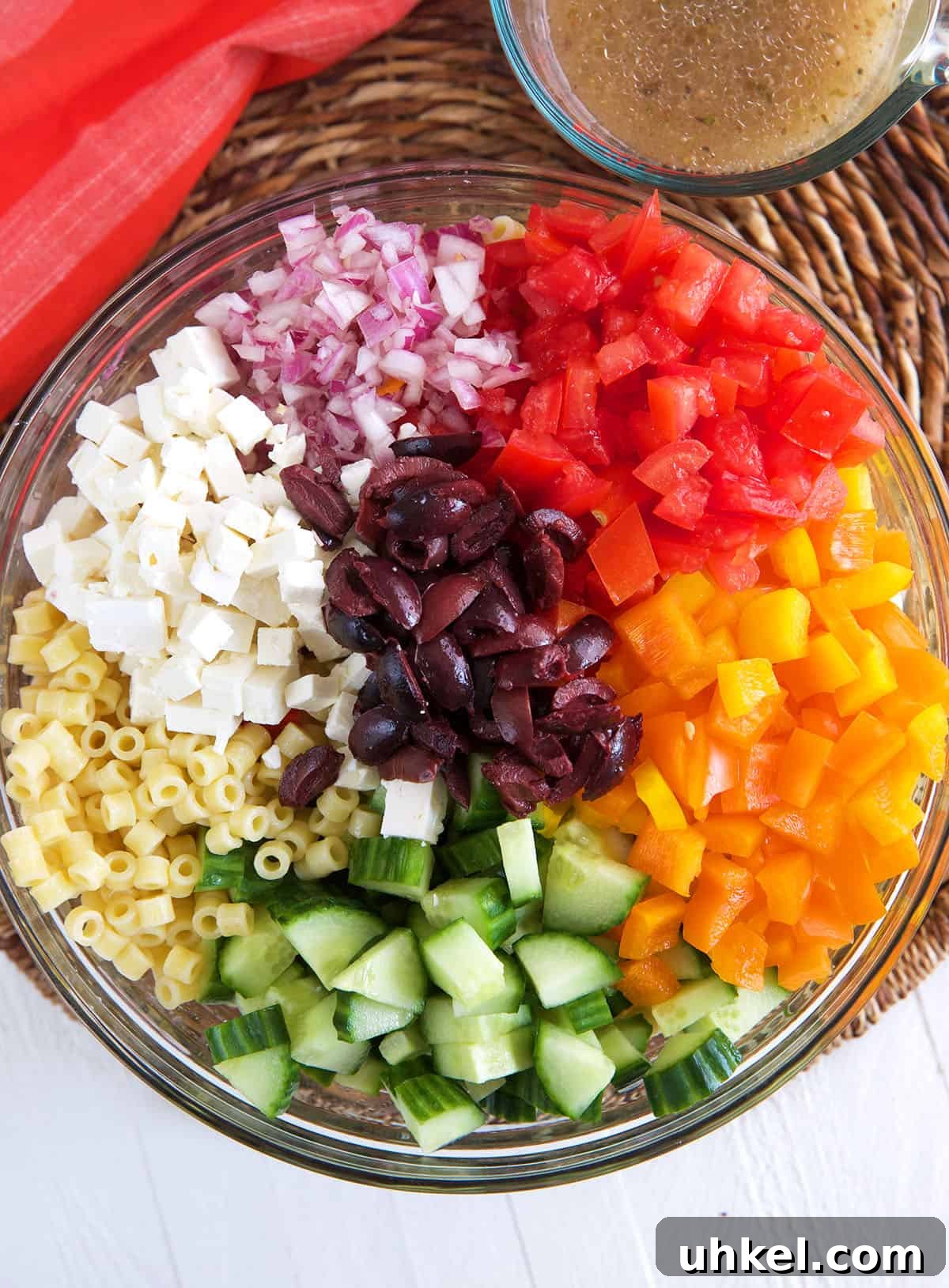 Greek Pasta Salad with Feta, Olives & Fresh Tomatoes 4 Greek pasta Salad ingredients in a glass bowl
