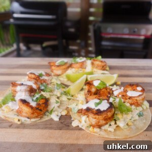 Grilled Shrimp Tacos with Zesty Corn Slaw 14 3 grilled shrimp with corn slaw tacos on cutting board