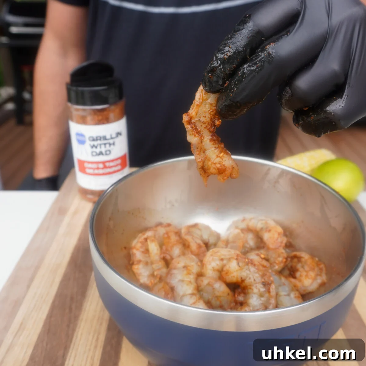 Grilled Shrimp Tacos with Zesty Corn Slaw 7 raw shrimp seasoned with Dad's Taco Seasoning in yeti bowl.
