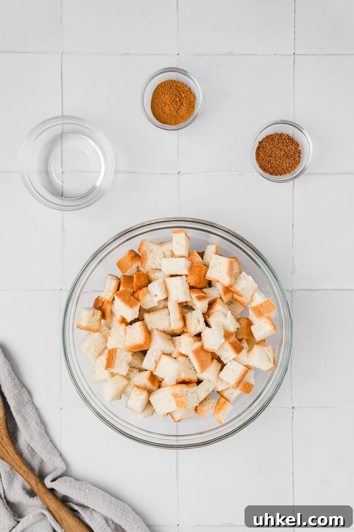 Roasted Butternut Squash and Apple Soup 5 A bowl of bread cubes with a few small pinch bowls of ingredients around the side.