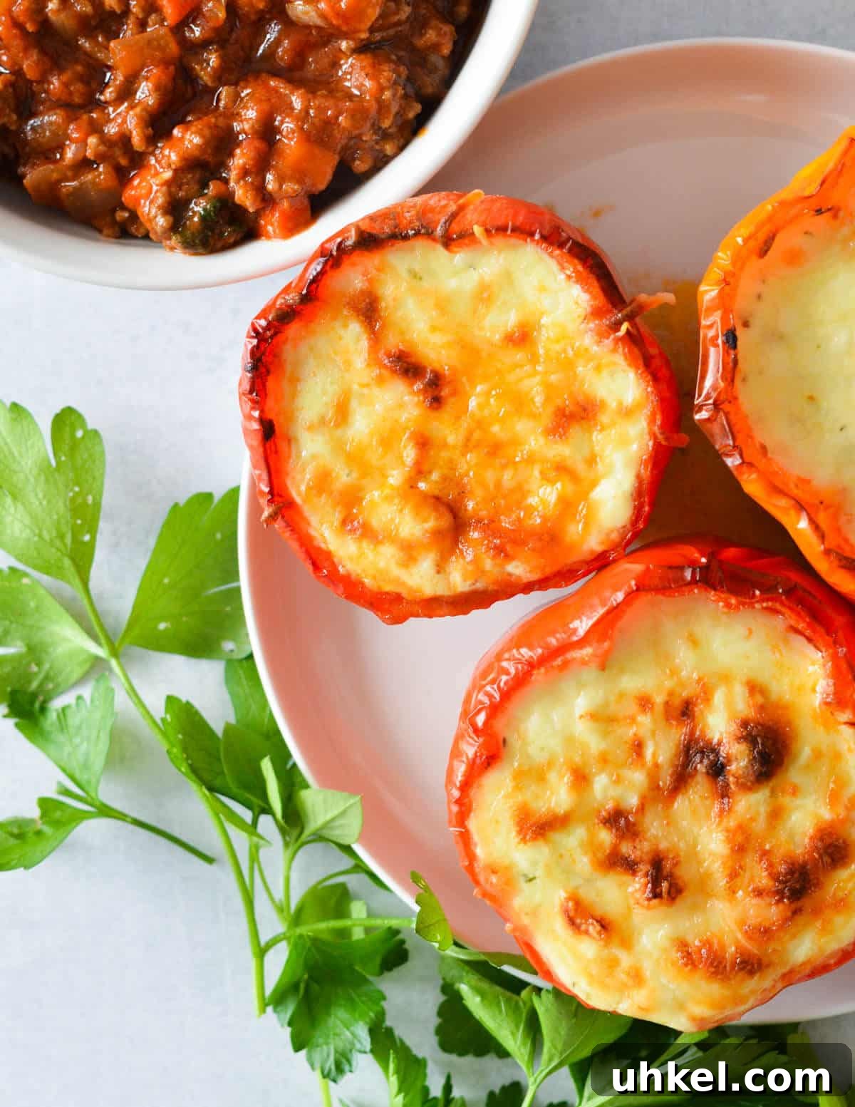 Lasagna Stuffed Bell Peppers with Savory Italian Filling 9 lasagna bell peppers on a plate.