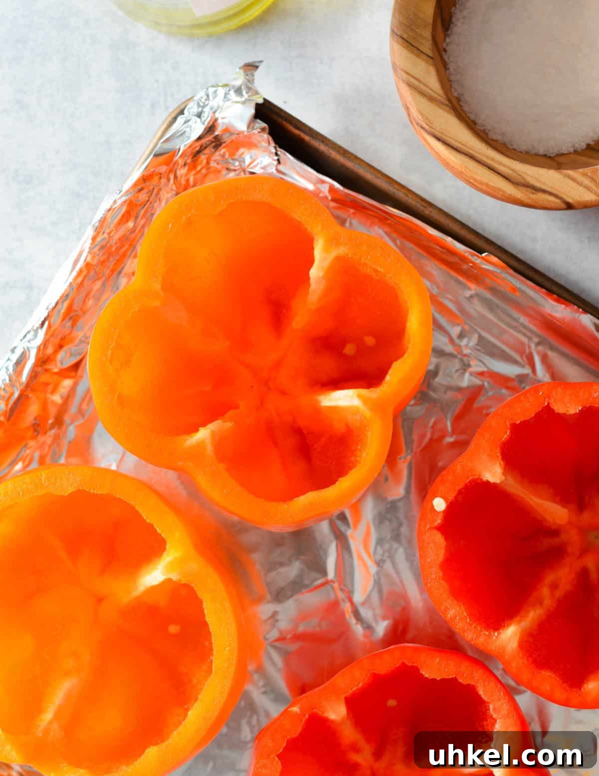 Lasagna Stuffed Bell Peppers with Savory Italian Filling 5 empty bell peppers with no tops or seeds on a sheet pan.