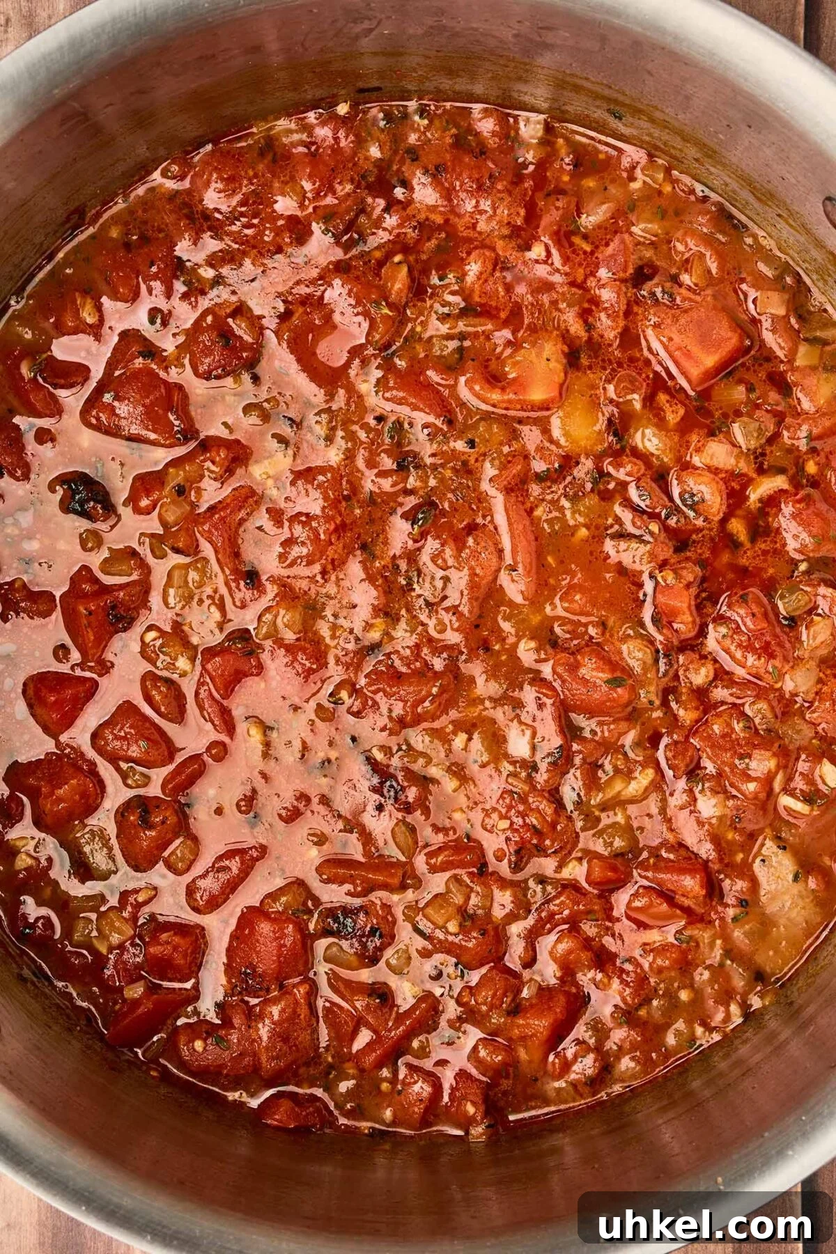 Smoky Fire-Roasted Tomato and Bacon Soup 6 Fire-roasted tomatoes and chicken broth simmering with sautéed onions and thyme for tomato and bacon soup.