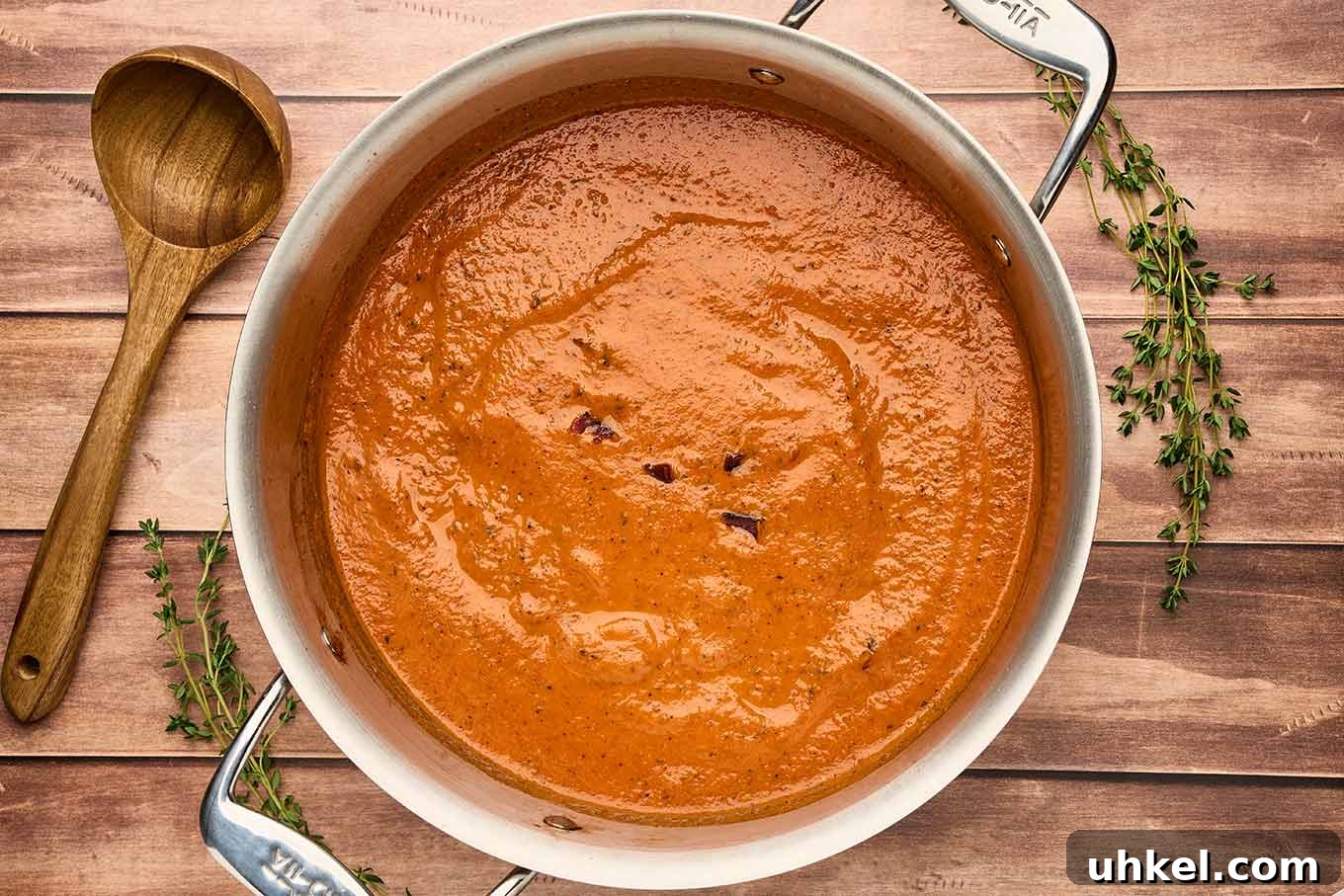 Smoky Fire-Roasted Tomato and Bacon Soup 8 Fire-roasted tomato and bacon soup in a pot after blending, finished with bacon and a swirl of cream.