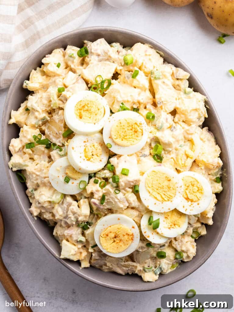 Creamy Classic Potato Salad Recipe 2 overhead potato salad with sliced hard boiled eggs
